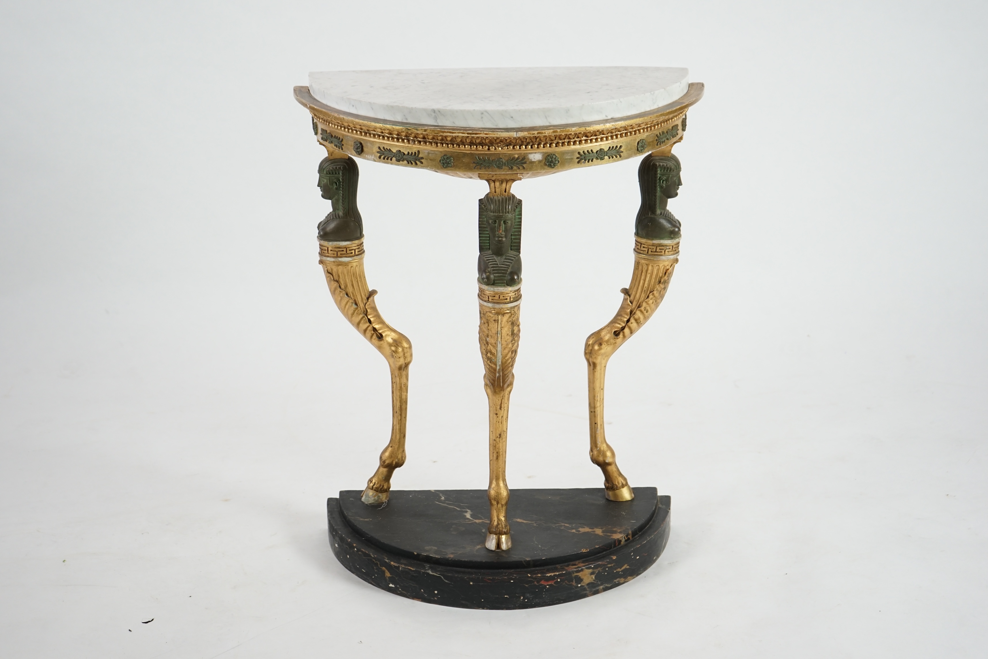 A Regency bronzed and giltwood demi-lune console table, in the manner of Thomas Hope